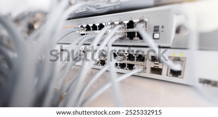 Close-up of set of cable network connected to internet switch servers in center. Control panel with wiring, electrical circuits. Provide internet concept