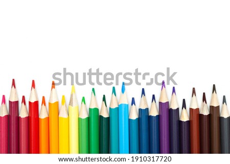 Close-up of set of colorful pencils on white background with copy space