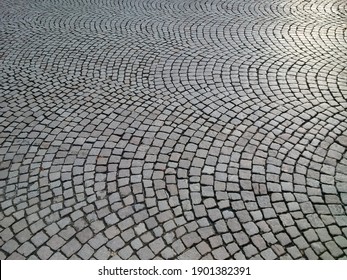 Close-up Of Sett Paving Or Belgian Block, Laid Out In A European Fan Pattern In Downtown Freiburg, Baden-Wuerttemberg, Germany.