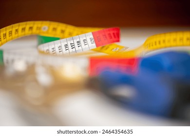 close-up sewing accessories lying on the table house of fashion and professional sewing