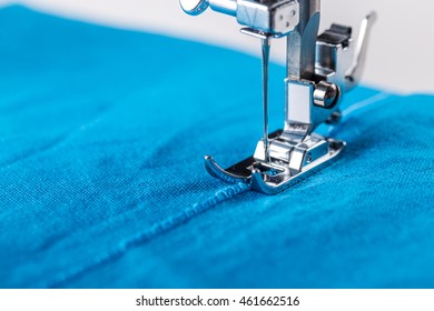 Close-up Of Sewing Machine And Fabric