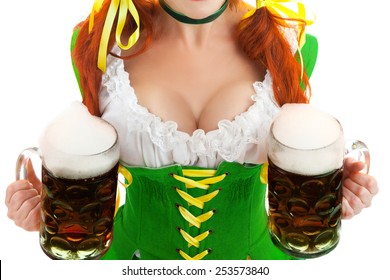 Closeup of Sexy Woman Wearing a Traditional Oktoberfest Costume with Two Beer Glasses . Isolated on White Background.