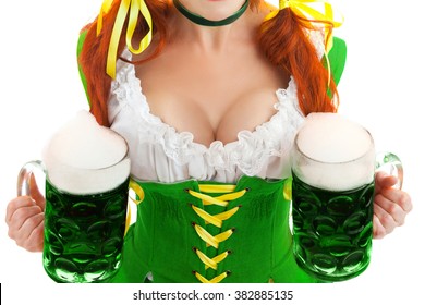 Closeup of Sexy Woman Wearing a Traditional Oktoberfest Costume with Two Green Beer Glasses . Isolated on White Background.