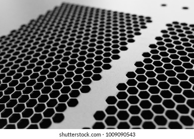 Close-up, Shallow Focus Of A Meshed Style Cooling Panel Used On A Main Frame Computer, Housed In A  Data Centre. The Honeycomb Holes Aid Active Venting Of Hot Air Within The Computer.