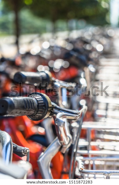 closeup of a\
shared bicycle parked on\
sidewalk