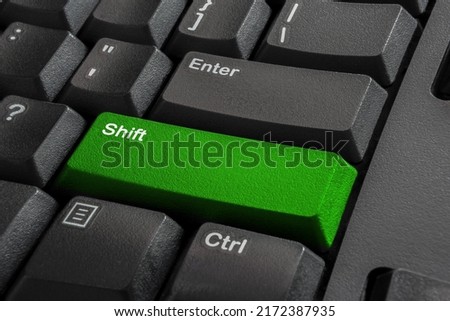 Close-up the Shift button on the classic keyboard and have Lime, Green color button isolate black keyboard. High quality photo.