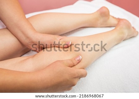 close-up shin massage. Anti-cellulite foot massage in spa salon.