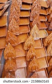 Close-up of shiny clay tiles for the roof of a Buddhist temple