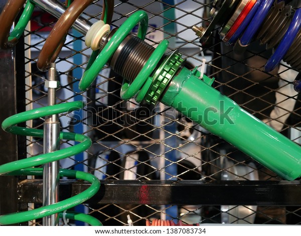 closeup of shock absorbers of car for sale in\
service station.