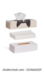 Close-up shoot of a black cat tissue box, a white paper tissue and a white tissue cover. The tissue holder is isolated on a white background. Front view.