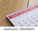 Closeup shot of a 2023 calendar, "September page". Selective focus shot of a calendar, focused on "September, 2023".