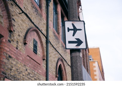 A Closeup Shot Of An Airport Sign On A Pole In Dublin, Ireland