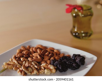 Close-up Shot Of An Almonds, Walnuts And Prunes