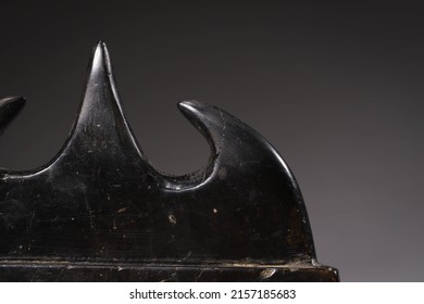 A Closeup Shot Of An Antique Black Chinese Calligraphy Pen Holder On A Gray Background