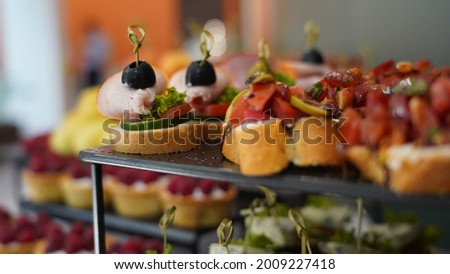 A closeup shot of appetizing mini snacks on a buffet table during a party