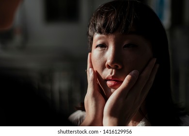 Closeup Shot Of Asain Couple Embracing And About To Kiss