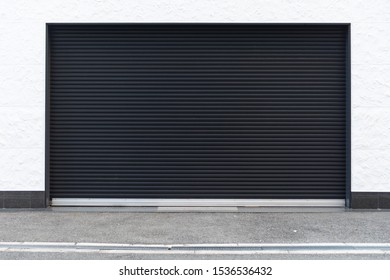 A Closeup Shot Of Automatic Metal Roller Door Used In Factory, Storage, Garage, And Industrial Warehouse. The Corrugated And Foldable Metal Sheet Offer Space Saving And Provide Urban And Rustic Feel