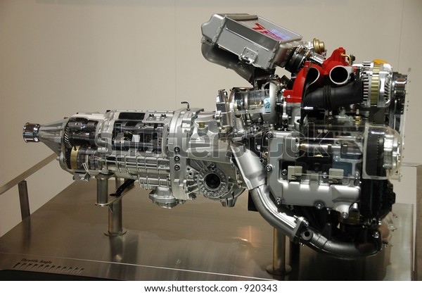 Close-up shot\
of an  automobile engine on\
display.