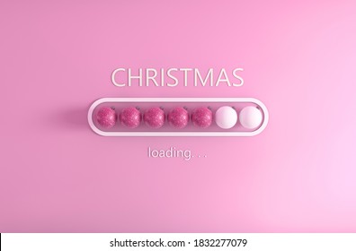 A closeup shot of balls and writing "Christmas, loading..." on pink background
