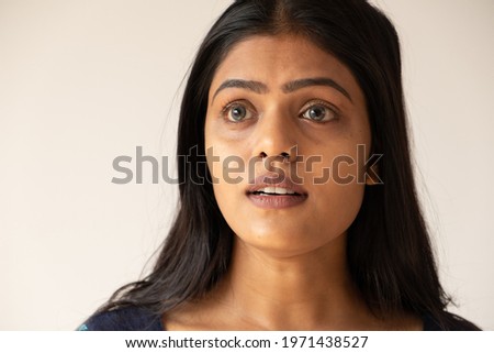 A closeup shot of a beautiful Asian girl on a white background
