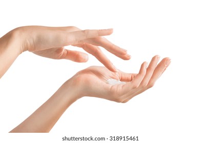 Closeup Shot Of Beautiful Female Hands Holding And Applying Moisturiser. Beauty Woman's Hand Applying Cream. Hands Isolated On White Background 