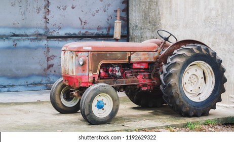 Closeup Shot Of A Beautiful Red Vintage Tractor Or Tracktor, Farm  / Agricultural Vehicle