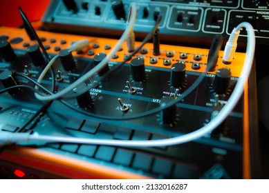 A closeup shot of a Behringer analog semi-modular synthesizer