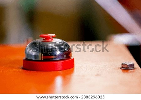 Close-up shot of a big red button to turn on and off the movement of the belt on a waste sorting line at a factory