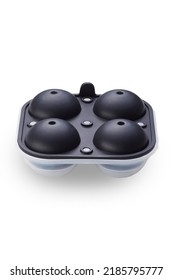 Close-up Shot Of A Black 4 Piece Silicone Ice Ball Mold With A Lid. The Spherical Ice Cube Mold Is Isolated On A White Background. Top View.