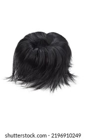 Close-up Shot Of A Black Detachable Chignon. The Chignon Hairpiece Made Out Of Black Synthetic Hair Is Isolated On A White Background. Front View.