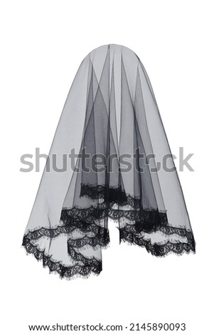 Close-up shot of a black veil. The bridal veil is with a lace applique. The wedding bridal veil is isolated on a white background. Front view.