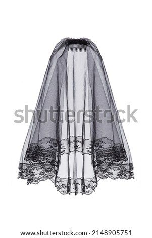 Close-up shot of a black veil with a comb. The bridal veil with lace applique. The wedding bridal veil is isolated on a white background. Front view.
