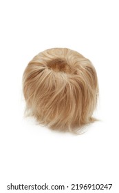 Close-up Shot Of A Blonde Detachable Chignon. The Chignon Hairpiece Made Out Of Blonde Synthetic Hair Is Isolated On A White Background. Front View.