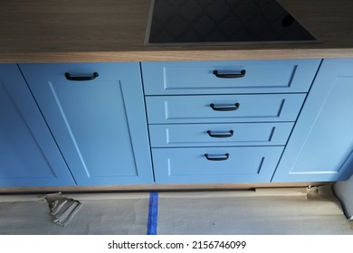 A Closeup Shot Of The Blue Drawers Of A New Build Kitchen