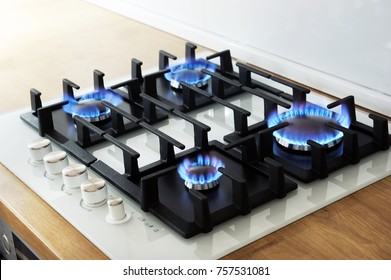Closeup shot of blue fire from domestic kitchen stove. Gas cooker with burning flames propane gas - Shutterstock ID 757531081