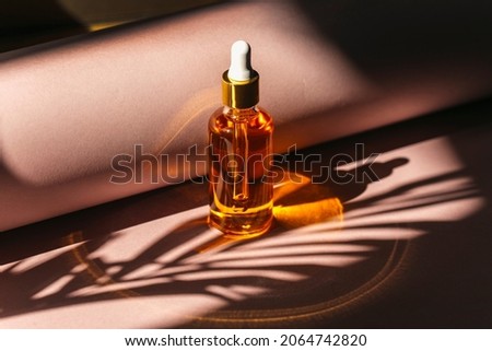 a closeup shot of bottle of essential oil with dropper