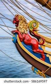 A Close-up Shot Of A Bright Red Lion Nautical Figurehead On A Vintage Sailing Ship At MacMillan Pier In Provincetown, Massachusetts