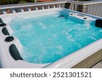 Close-up shot bubbling water in hot tub with headrests