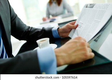Close-up shot of a businessman reading the latest news - Shutterstock ID 105597614