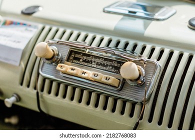 A close-up shot of the buttons of the radio of an old VW bus car