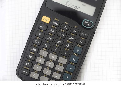 A Closeup Shot Of A Calculator Showing Error