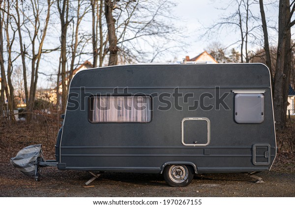 A closeup\
shot of a caravan car on the\
mountain