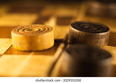 A Closeup Shot Of A Checkers Board And Wooden Game Pieces On It