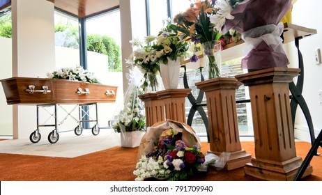 closeup shot of a colorful casket in a hearse or chapel before funeral or burial at cemetery
