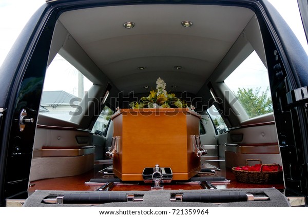 closeup shot of a colorful casket in\
a hearse or chapel before funeral or burial at\
cemetery\
