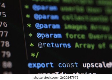 Close-up shot of computer code displayed on a dark screen. The code includes parameters and returns, with green and blue text highlighting different elements.
