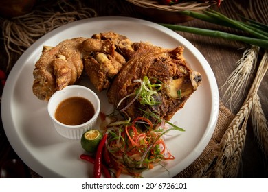 A closeup shot of crispy pata, deep-fried pork knuckle in a restaurant