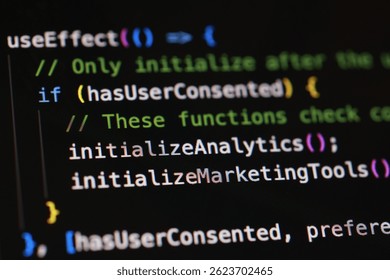 A close-up shot displays colorful computer code on a dark screen, showcasing software development and programming. 