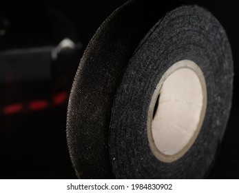 A Closeup Shot Of A Duck Tape Roll On A Black Background