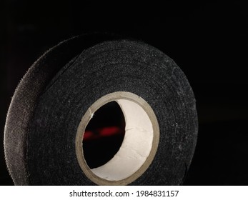 A Closeup Shot Of A Duck Tape Roll On A Black Background